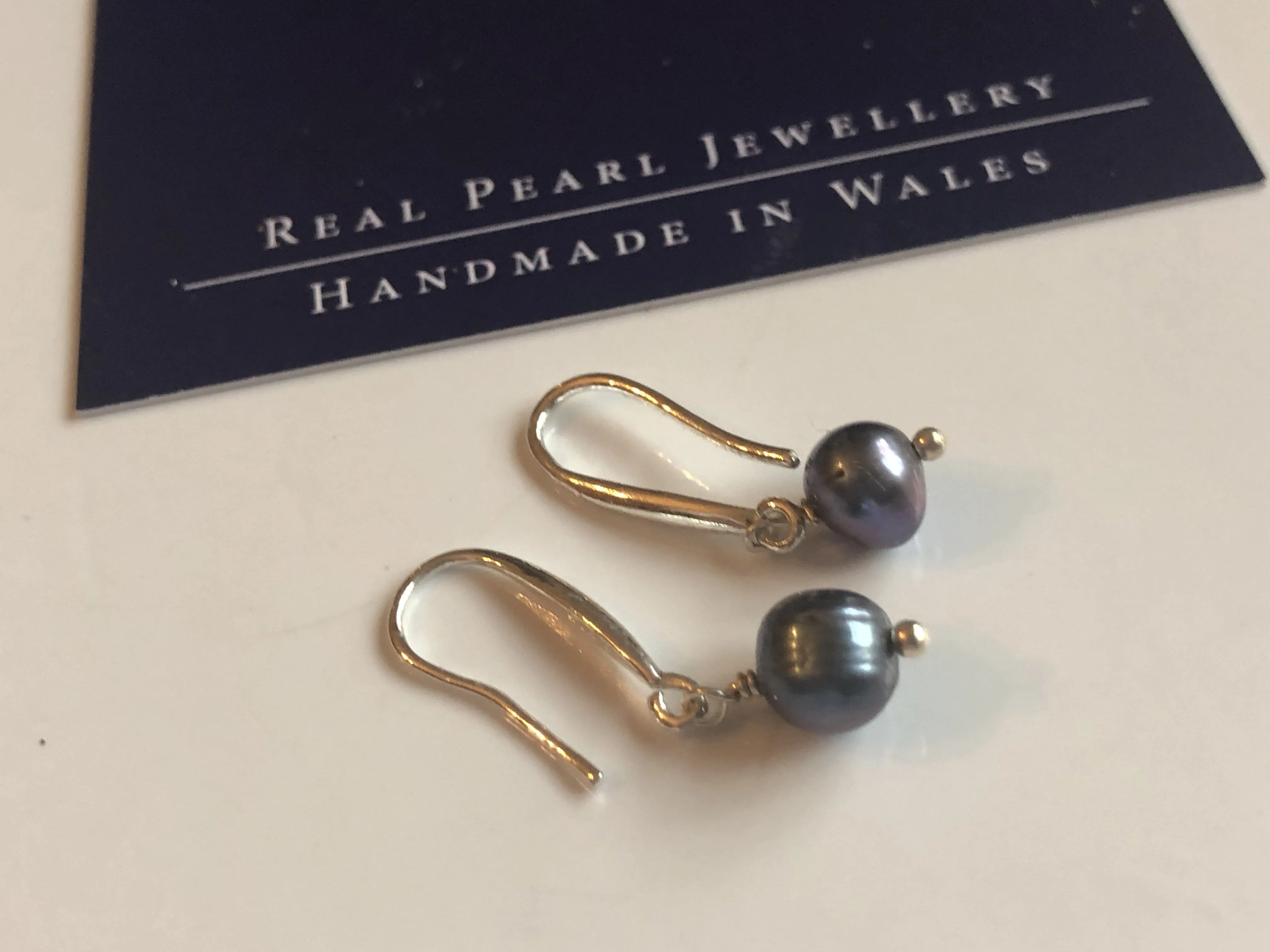 Earrings: Single peacock freshwaterpearl drop earrings