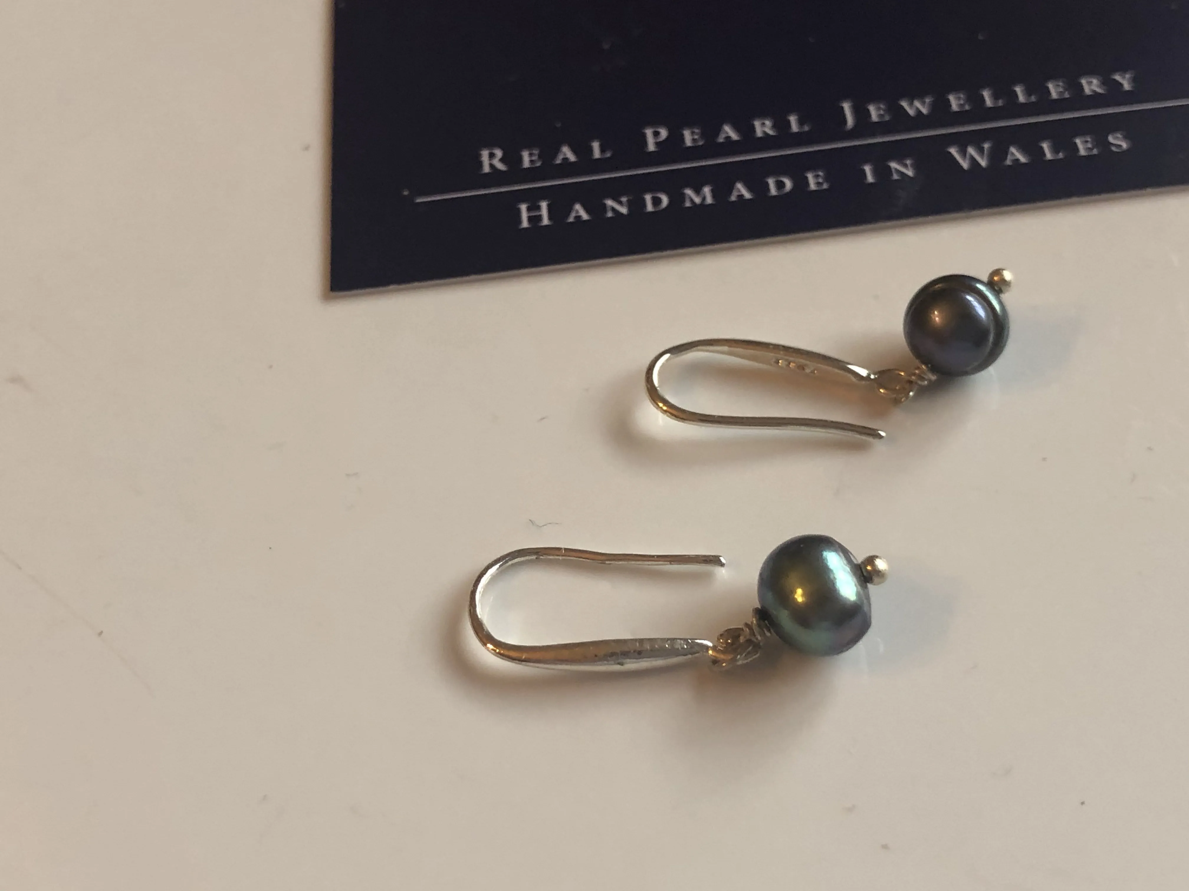 Earrings: Single peacock freshwaterpearl drop earrings